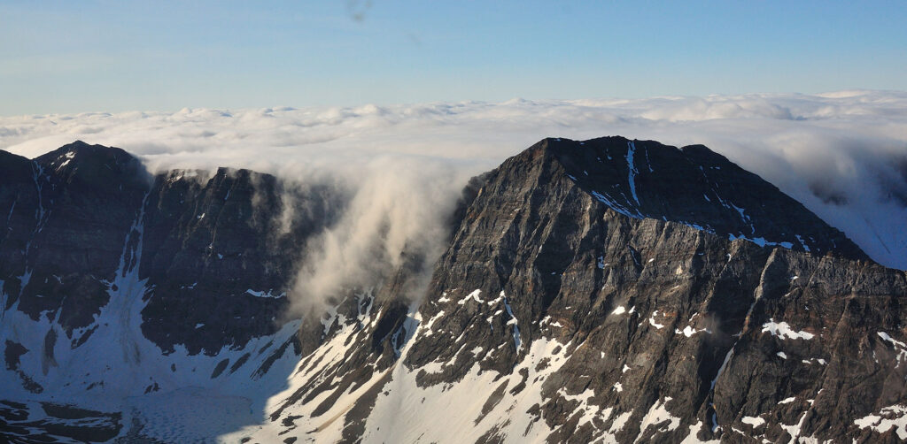 mountain range-clouds-snow-black mountains-graphite